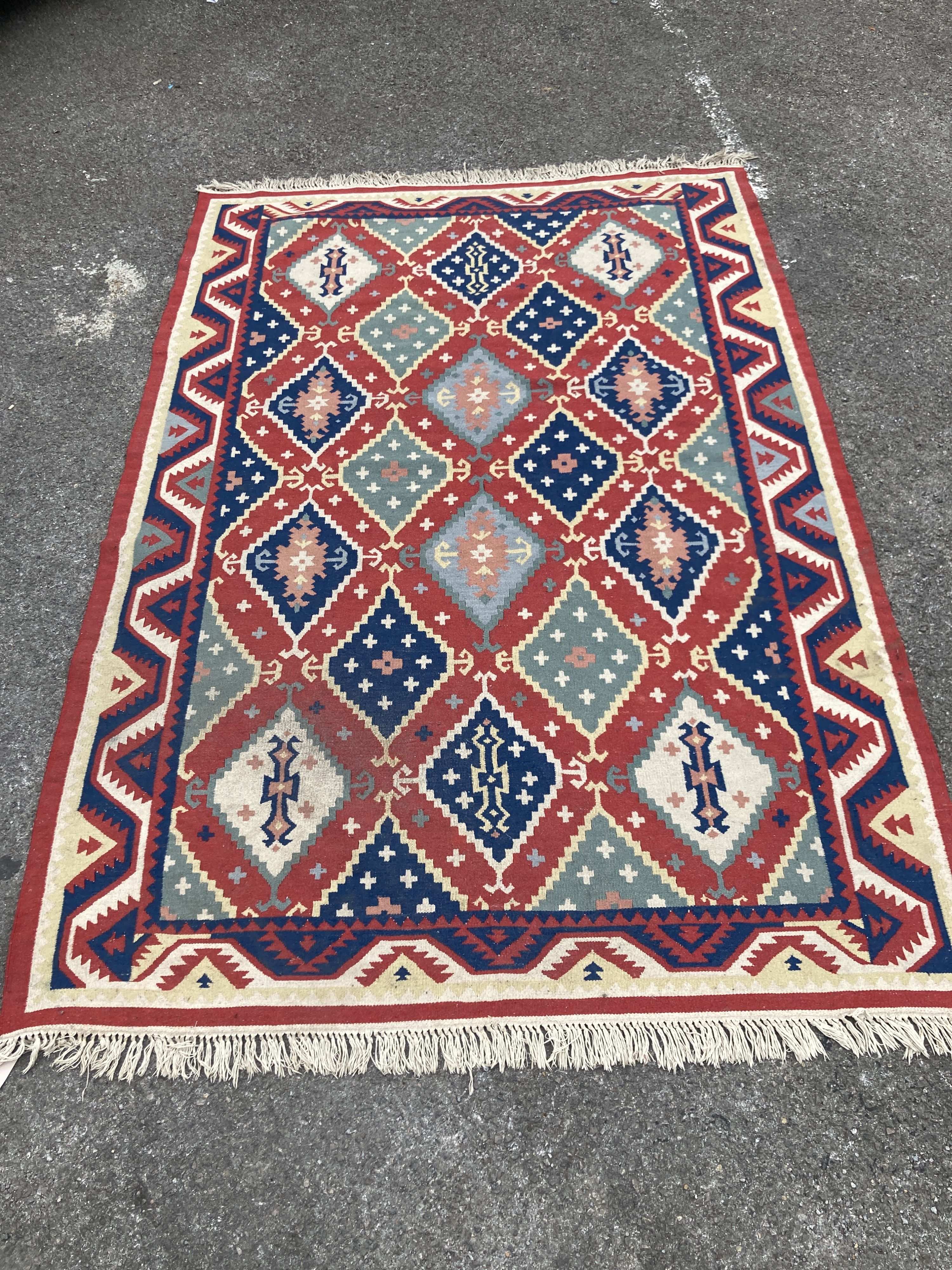A Kelim flatweave polychrome geometric carpet, 240 x 160cm